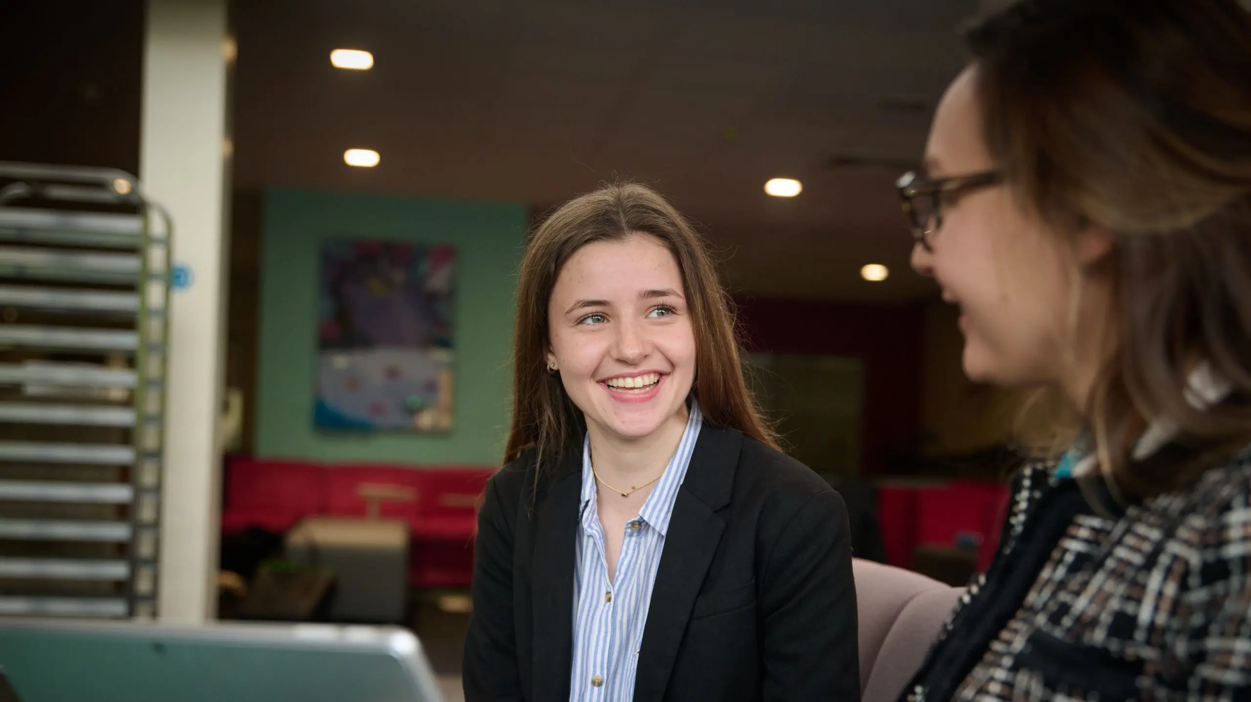 The Grange School Sixth Form Pupil having a conversation with a teacher.