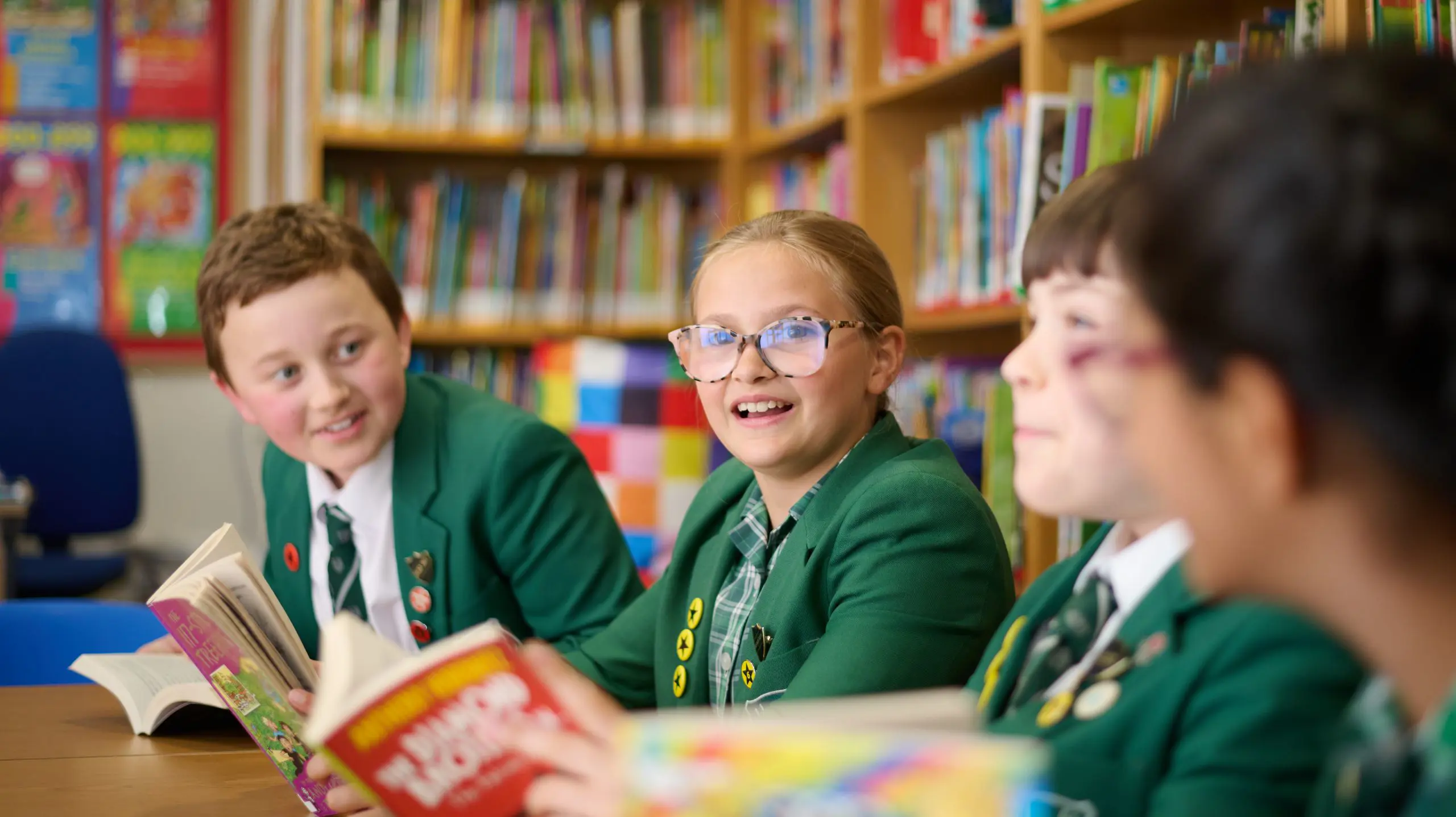 The Grange School Junior pupils reading in the library.