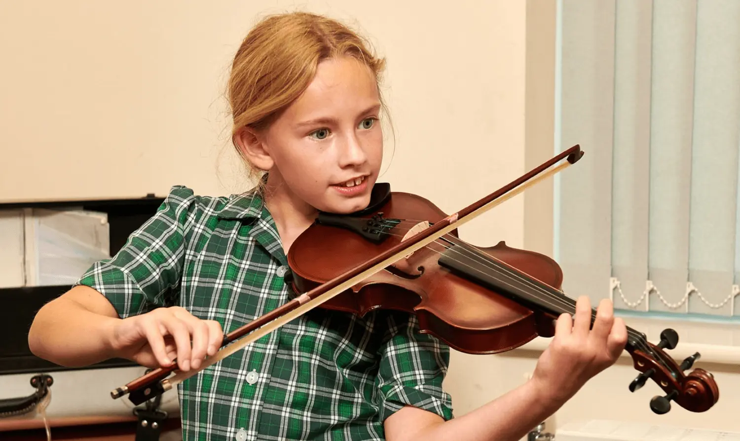The Grange School junior pupil playing the violin.