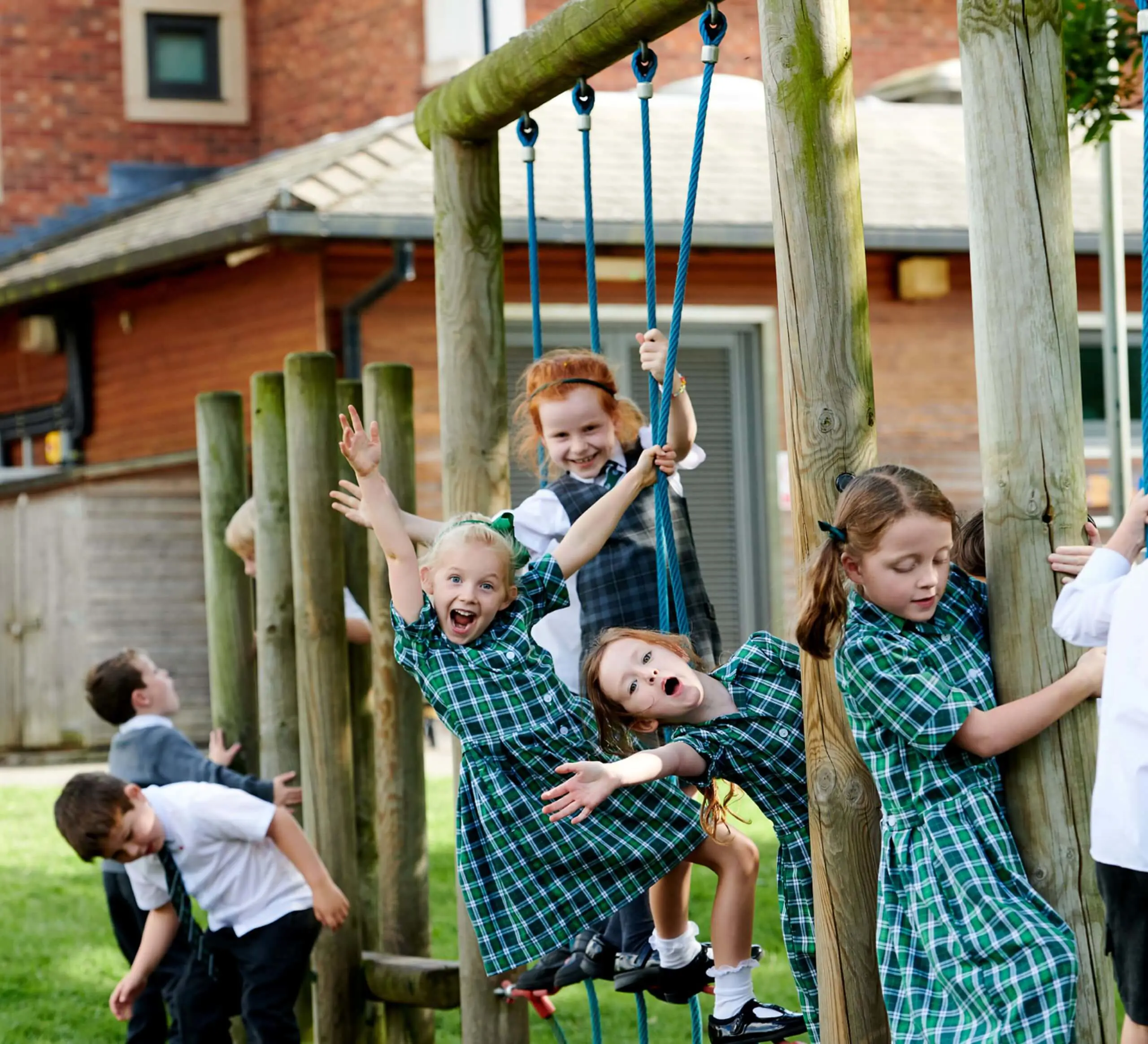 The Grange Junior School pupils playing on a climbing frame.