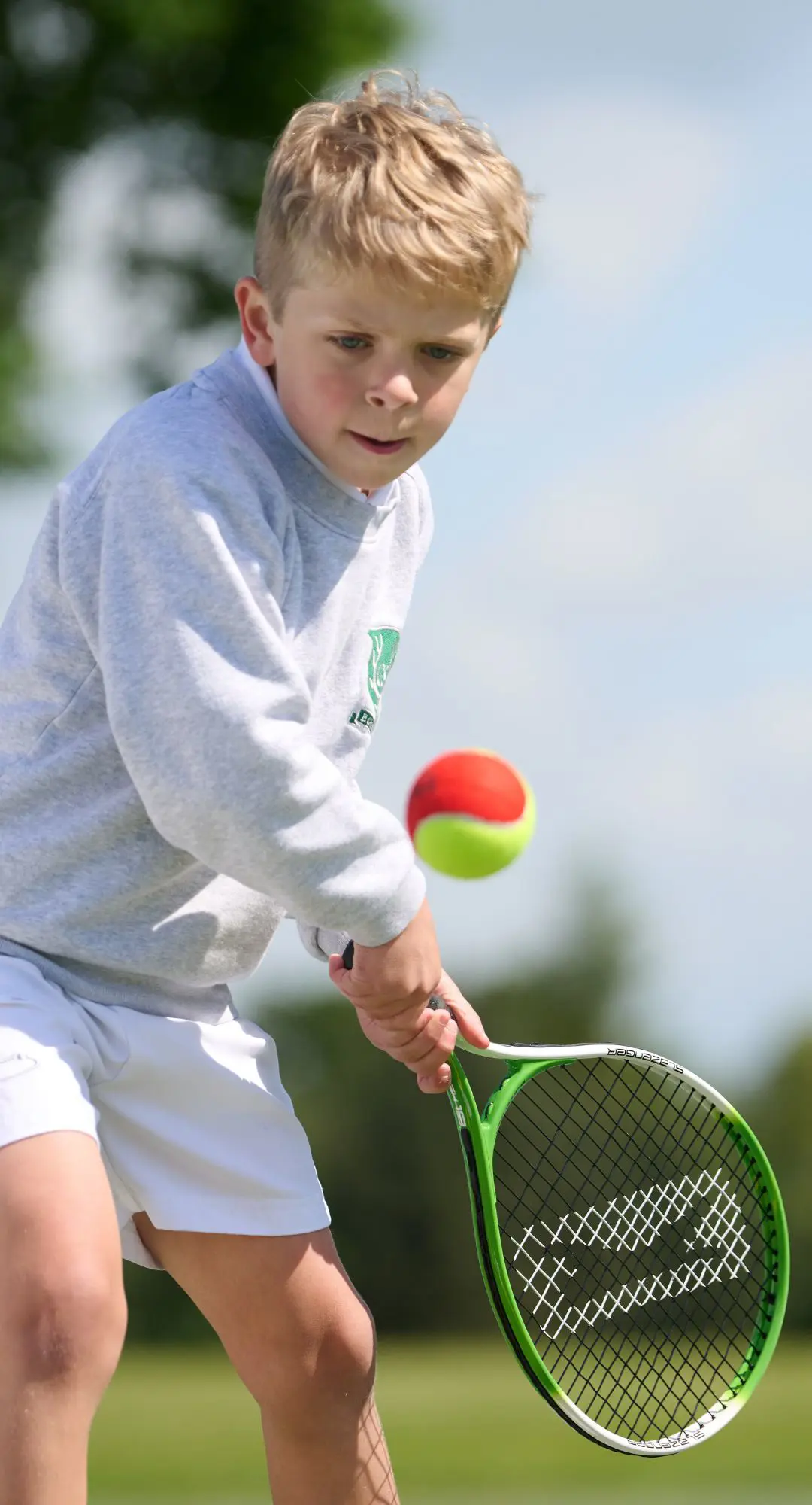 The Grange School junior pupil playing tennis.