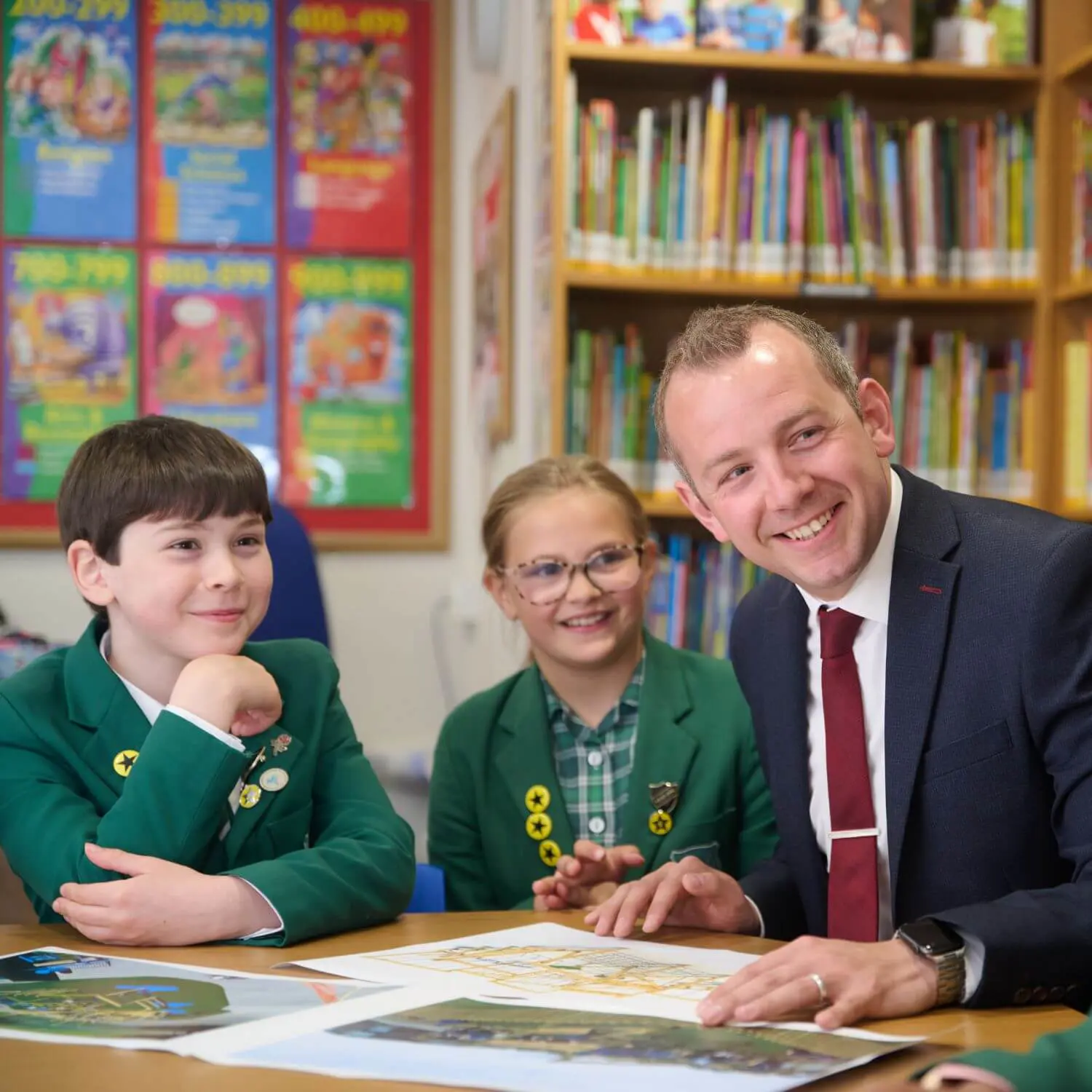 The Grange School, Head of Junior with pupils in the library.