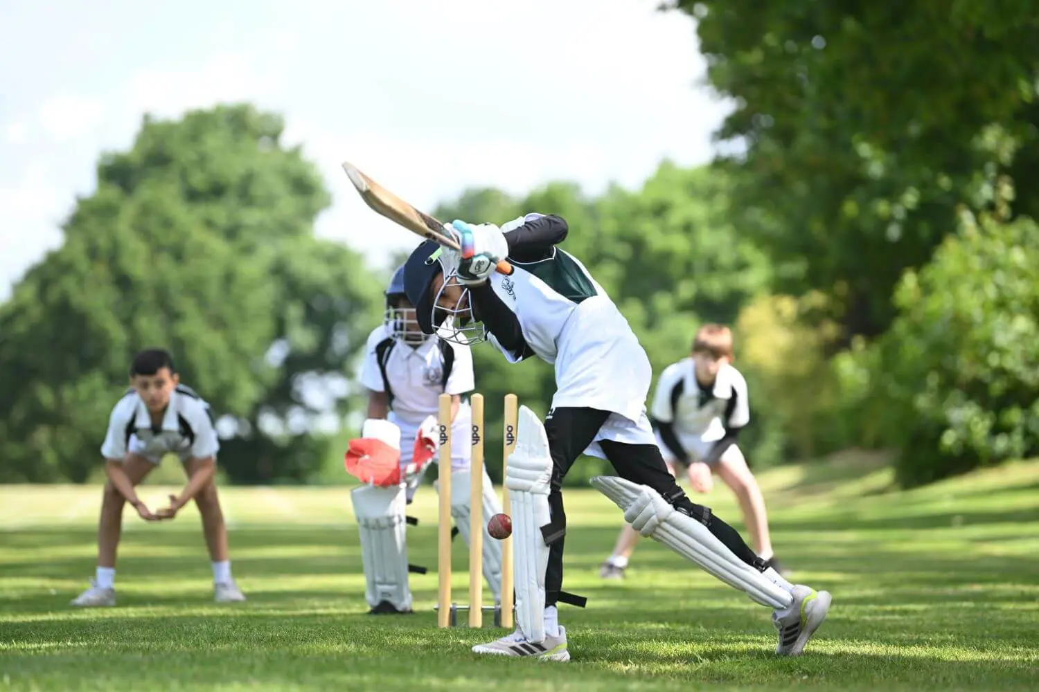 The Grange School Junior pupils playing cricket.