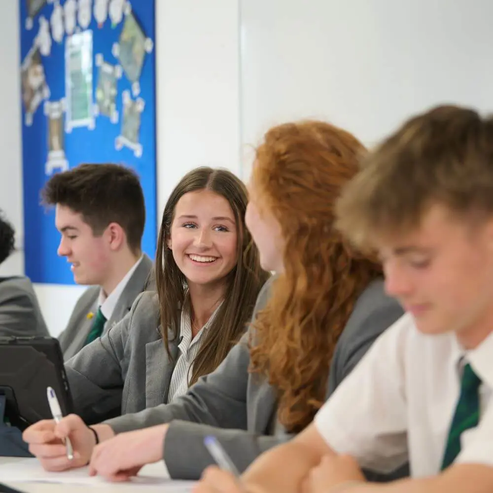 Children smiling in a lesson.