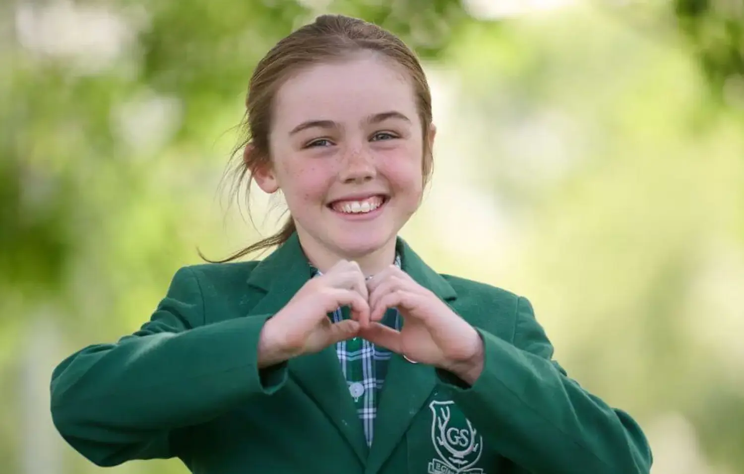 The Grange School junior pupil in woodland.