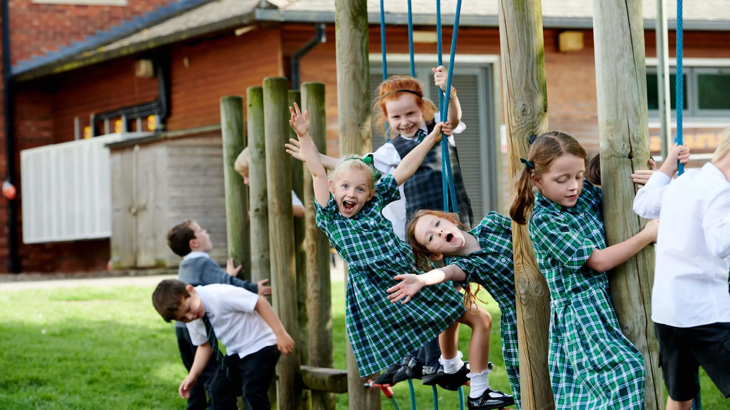 The Grange Junior School pupils playing on a climbing frame.