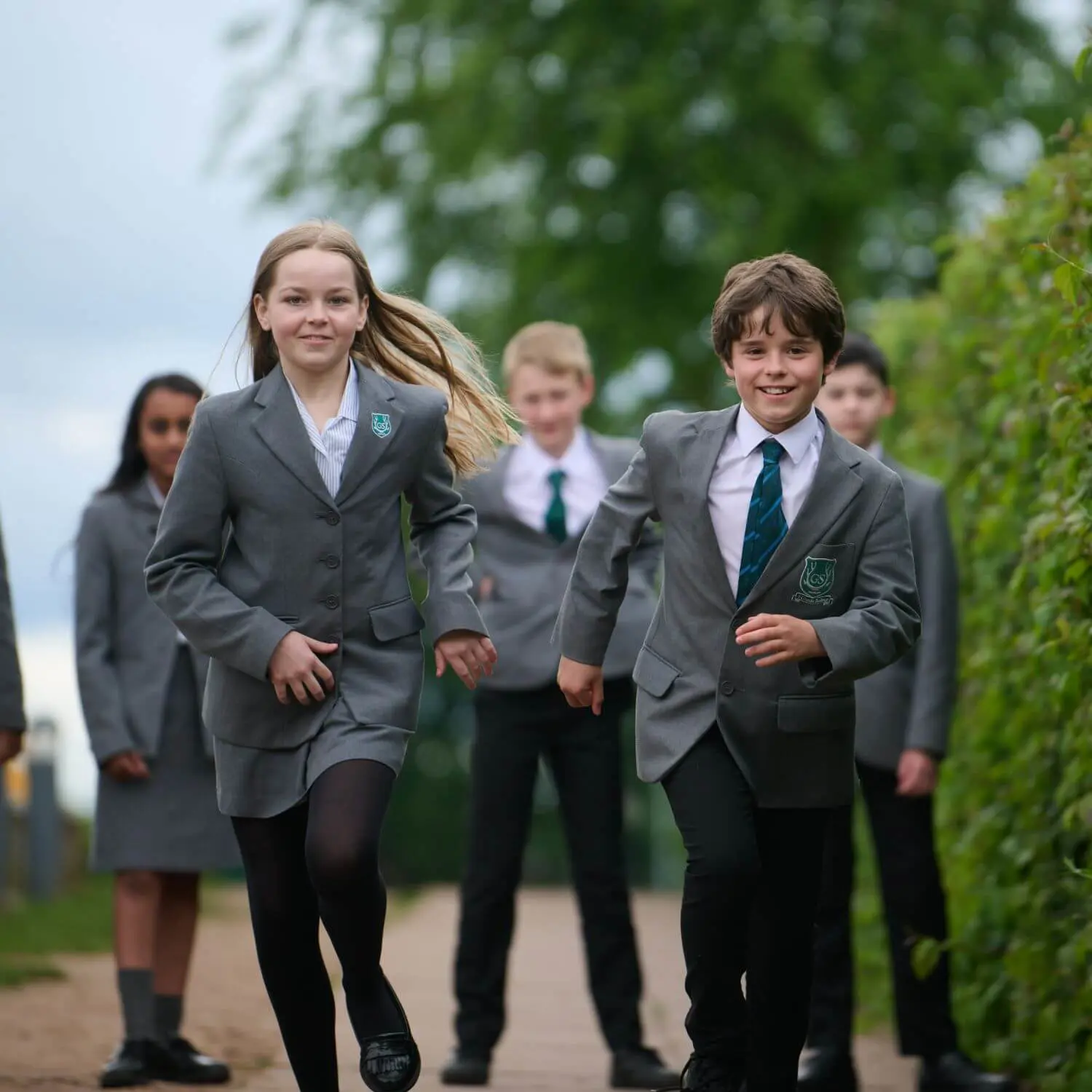 The Grange School senior pupils running towards the camera.
