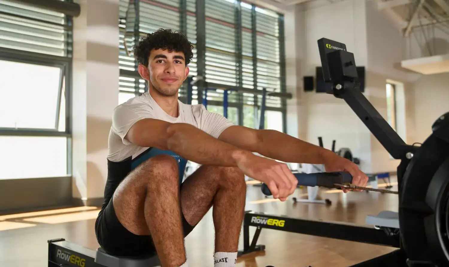 The Grange School Sports Centre, Senior pupil using gym equipment.