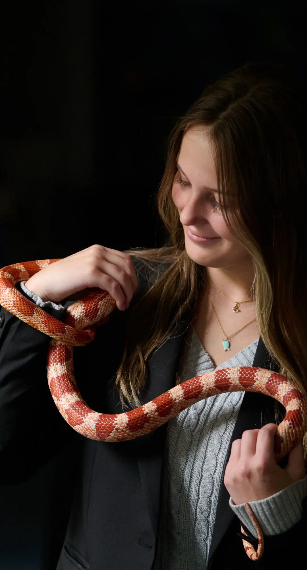The Grange Sixth Form biology student holding a snake.