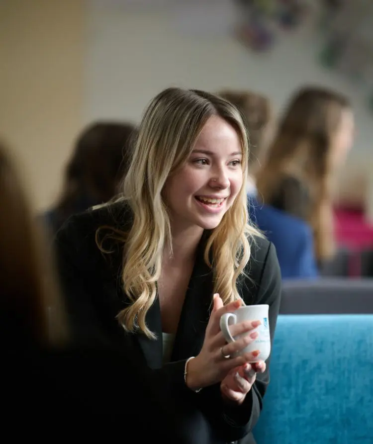  The Grange School Sixth Form pupil with a cup of tea.